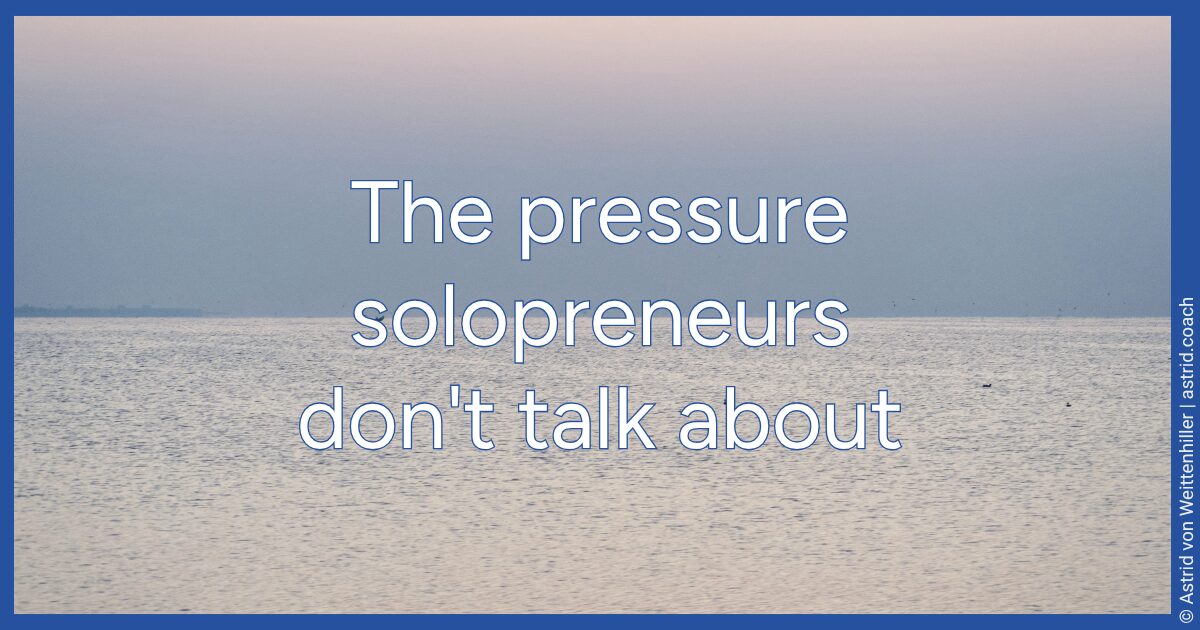 Calm water with a flat horizon in soft blue and pink light. Title: The pressure solopreneurs don't talk about.